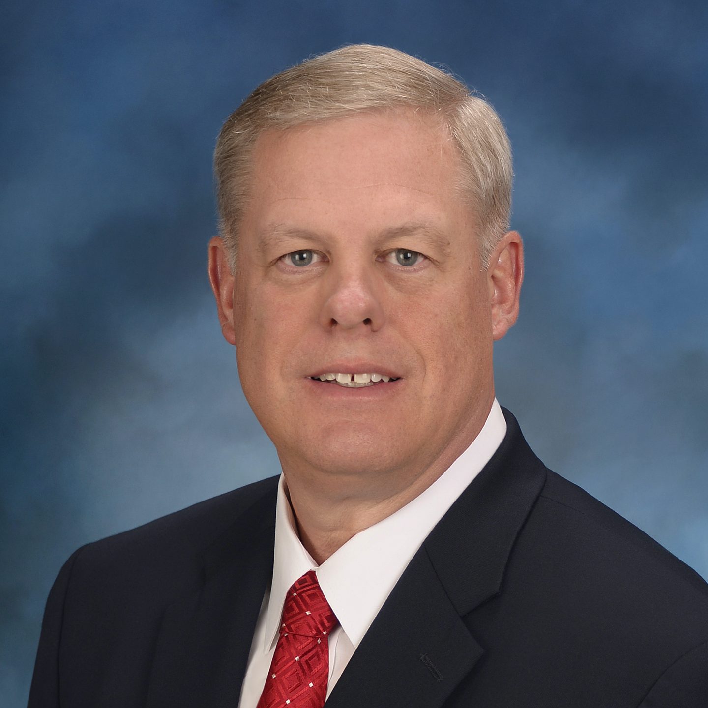 Rodney Roederer, eid K4551, USAA employee, formal portrait, on blue, COO